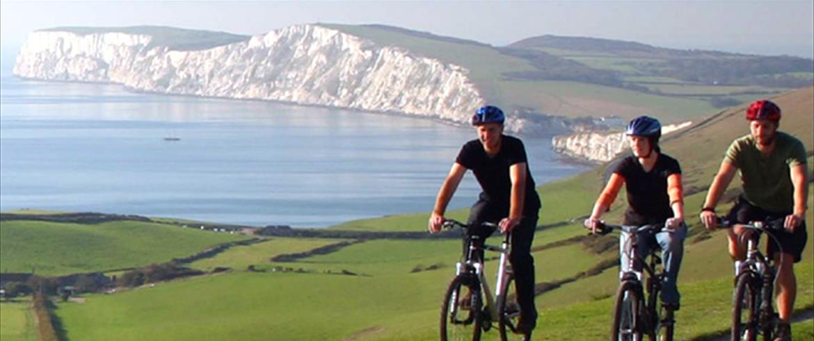 cycling above Compton Farm with The Wight Cliffs in the background